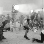 Charli XCX Puts Vincent Cassel Through a Brutal Day on Set in the "Camera" Video